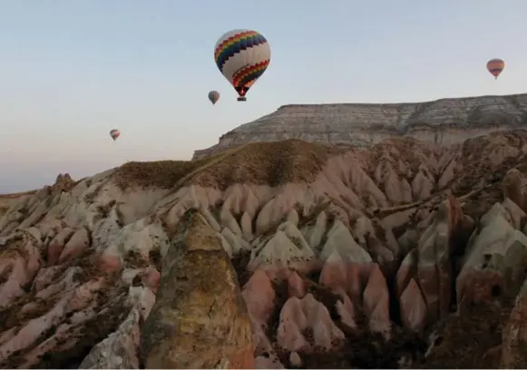  ?? RUSSELL VANCE ?? Kapadokya Balloons offers hot-air balloon rides above the stunning rock formations and “fairy chimneys” of Goreme National Park in Turkey. See story on T2. Whether it’s high above a faraway place like Turkey or nearer to home, on a trip to Arizona, taking to the sky in a balloon offers a chance to gain a new perspectiv­e on an unfamiliar landscape.