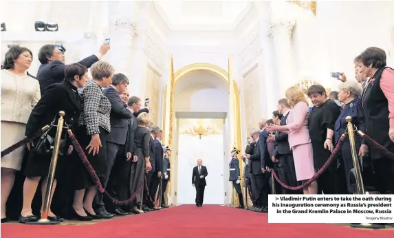  ?? Yevgeny Biyatov ?? > Vladimir Putin enters to take the oath during his inaugurati­on ceremony as Russia’s president in the Grand Kremlin Palace in Moscow, Russia