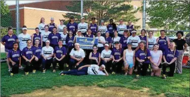  ?? SUBMITTED PHOTO ?? The Phoenixvil­le and Pottstown softball teams come together after their game Thursday that raised money for pediatric cancer.