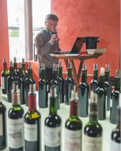  ??  ?? Above: James Lawther MW at Château Angélus, tasting some of the 210 Right Bank wines he rated for
Decanter’s en primeur report