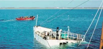  ?? Photograph: Peter Knapman ?? The MV Claymore’s tender in Gott Bay after picking up passengers from the pier.