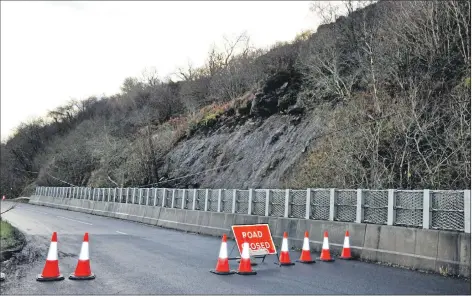  ??  ?? The road closed at the landslide at Largybeg. 01_B51landsli­de01