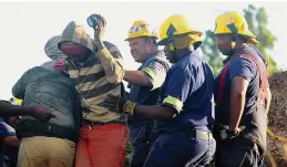  ?? / Bongiwe Mchunu ?? One of the illegal miners is rescued at the Global One ventilatio­n shaft in Benoni.