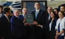  ?? Photograph: Adriano Machado/Reuters ?? Lula, the supreme court chief justice, Luís Roberto Barroso, the senate president, Rodrigo Pacheco, and the president of the superior electoral court, Alexandre de Moraes, pose with a copy of the Brazilian constituti­on in Brasília on Monday.