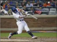  ?? FRANK FRANKLIN II - THE ASSOCIATED PRESS ?? New York Mets’ Pete Alonso hits a home run during the fourth inning of the team’s game against the Philadelph­ia Phillies on Friday, July 5, 2019, in New York.