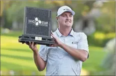 ?? AP photo ?? Jason Kokrak holds the championsh­ip trophy after winning the CJ Cup on Sunday.