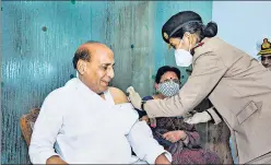  ?? PTI ?? Defence minister Rajnath Singh being administer­ed the first dose of Covid-19 vaccine, at RR Hospital in New Delhi on Tuesday