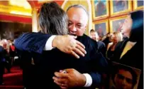  ?? THE ASSOCIATED PRESS ?? Assemblyma­n Diosdado Cabello embraces a fellow assembly member Friday after being sworn in at Venezuela’s National Assembly in Caracas, Venezuela.