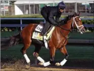  ?? GARRY JONES — THE ASSOCIATED PRESS ?? Exercise rider Isabelle Bourez puts Kentucky Derby hopeful Patch through his morning workout at Churchill Downs in Louisville, Ky., Tuesday.