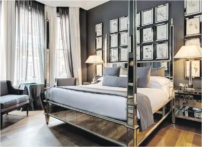  ??  ?? The sparkle of mirrored surfaces radiates off the dark bedroom walls at the Franklin Hotel in London.