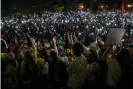  ?? Photograph: Amy Harris/REX/Shuttersto­ck ?? Protesters hold cellphone lights as they gather at the justice center and courthouse as feds attempt to intervene after weeks of protests in Portland.