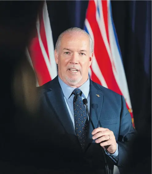  ?? POSTMEDIA FILES ?? B.C. Premier John Horgan says his government has tried to be “pragmatic and focused on outcomes that work for everybody” over the past year, introducin­g new programs while keeping the budget balanced.