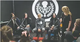  ?? BRANDON HARDER ?? School of Rock owner Laurie Schulz introduces Cory Churko, left, Todd Kerns, Shane Gaalaas and Brent Fitz from the band Toque to an audience of young musicians, along with their parents and teachers.