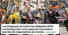  ?? PHOTO AFP ?? Les dirigeants de la Bourse philippine (PSE) ont festoyé hier à l’occasion de la première journée de négociatio­ns de l’année.