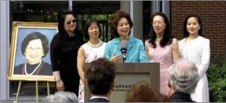  ?? HEZI JIANG / CHINA DAILY ?? Elaine Chao (center), former US Secretary of Labor, speaks on behalf of the Chao sisters at the dedication ceremony of the Ruth Mulan Chu Chao Center, which is named after their mother, in June on the Harvard Business School campus.
