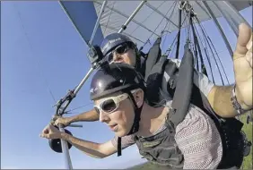  ?? Photos by Wallaby Ranch ?? Patrick Connolly hang glides with owner and instructor Malcolm Jones at Wallaby Ranch in Davenport, Florida.