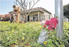  ?? — AFP photo ?? A bunch of flowers is seen outside the property where the five victims were found.