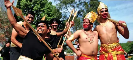  ??  ?? Performers pose for photograhs during Diwali celebratio­ns at Federation Square in Melbourne, Australia.