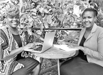  ??  ?? Kenyan publisher Angela Wachuka (Right) and author Wanjiru Koinange pose for a photo on Aug 2 in Nairobi.