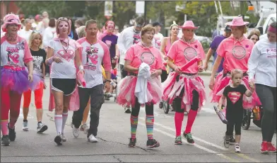  ?? Terrance Armstard/News-Times ?? Going pink: Runners and walkers fill the streets of downtown El Dorado as the 2017 Paint the Town Pink 5k run/ walk. The annual event is sponsored by #teamCorrie Cancer Foundation and raises funds to assist cancer patients.