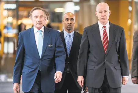  ?? Renee Jones Schneider / Minneapoli­s Star Tribune ?? Former police Officer Mohamed Noor (center) was found guilty of killing Justine Ruszczyk Damond, a white woman.