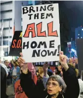  ?? JACK GUEZ/GETTY-AFP ?? Supporters of Israeli hostages call for their release Saturday during a march in Tel Aviv.