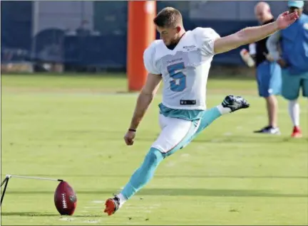  ?? ASSOCIATED PRESS FILE ?? Greg Joseph works during a drill at Dolphins training camp Aug. 13 in Davie, Fla.