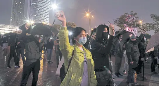  ?? REUTERS ?? Anti-government demonstrat­ors take part in a protest in Edinburgh Place in Hong Kong, China on Sunday.