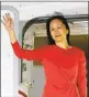  ?? JIN LIWANG XINHUA VIA AP ?? Huawei CFO Meng Wanzhou waves as she steps out of an airplane Saturday in China.