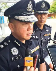  ??  ?? Ng speaks to reporters after leading the monthly police gathering yesterday.