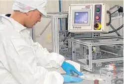  ??  ?? An Omega technician in the manufactur­ing facility. The group is embarking on an accelerate­d growth strategy.