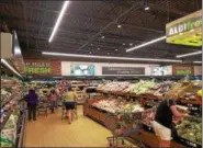  ?? DIGITAL FIRST MEDIA FILE PHOTO ?? Aldi opens in Pottstown on Thursday morning at the Pottstown Center Shopping Center. Aldi stores have a similar layout — designed for ease of shopping. This photo shows the produce department at the Aldi in Lower Pottsgrove.