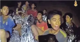  ?? ROYAL THAI NAVY FACEBOOK PAGE VIA AP ?? A video shows members of the soccer team in good spirits. The teens and their coach were trapped inside a cave in Thailand.