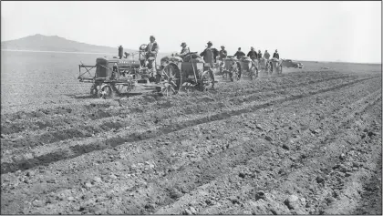  ?? (File Photo/AP) ?? Using light tractors, Japanese residents of their Relocation Center at Tule Lake California, begin planting potatoes in May 1943 in the several hundred acres of fertile soil of reclaimed old Tule Lake.