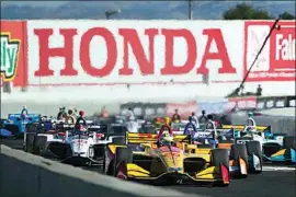  ?? ELIJAH NOUVELAGE / AP, FILE ?? Ryan Hunter-Reay (28) leads in the Verizon IndyCar Grand Prix of Sonoma auto race, Sept. 16, 2018, in Sonoma.