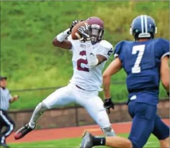  ?? SAM STEWART — DIGITAL FIRST MEDIA ?? Pottsgrove running back Rahsul Faison hauls in a 37-yard touchdown pass last season during a game against Pottstown. Faison lit it up in his first year with the Falcons, finishing with 2,207 total yards and 27 touchdowns.