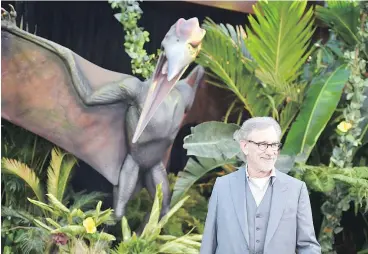  ?? — ROBYN BECK/GETTY IMAGES ?? Digital additions made in post-production to Jurassic World, released in 2015, had to be approved by executive producer Steven Spielberg.