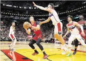  ?? AL DIAZ adiaz@miamiheral­d.com ?? Heat forward Duncan Robinson has seen a back specialist and is listed as day-to-day before he’ll be cleared to play.