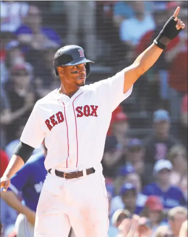  ?? Maddie Meyer / Getty Images ?? Xander Bogaerts celebrates after scoring a run against the Blue Jays during the eighth inning at Fenway Park on Wednesday.