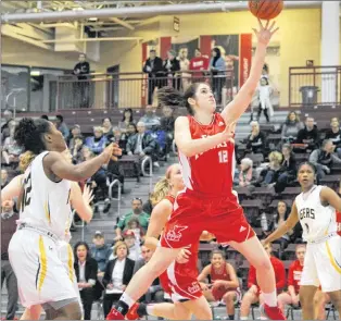  ?? JENNA ROBERTSON PHOTO ?? Cameron Longley of the Memorial Sea-hawks intercepts a Dalhousie Tigers pass during play in an AUS women’s basketball game Sunday at the Field House. The Sea-hawks swept the Tigers in a pair of games.