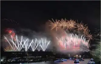  ??  ?? Fireworks light the sky over the Harbor Bridge during New Year’s Eve celebratio­ns in Sydney.