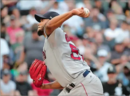  ?? NAM Y. HUH/AP PHOTO ?? Boston Red Sox starting pitcher Eduardo Rodriguez throws to a Chicago White Sox batter during the first inning Saturday in Chicago. Rodriguez retired his first 12 batters, striking out 10, as the Red Sox won 6-1 to maintain a 7.5-game lead over the New York Yankees.