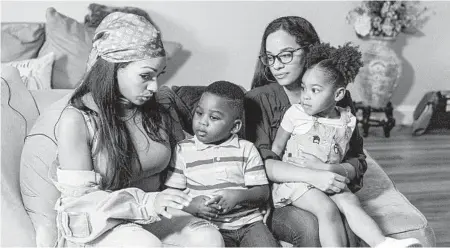  ?? MARY ALTAFFER/AP ?? Older siblings Katherine, left, and Jennifer Guzman take care of Zavion, 4, and Jazzmyn, 2, after their mother died.