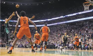  ?? Mary Schwalm / Associated Press ?? Boston forward Al Horford (left) launches the game-winning shot against Portland in Boston.