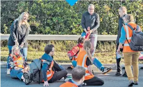  ??  ?? A motorway protest by Insulate Britain, top, led to tempers being lost as the M25 was targeted.