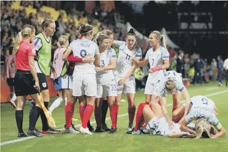 ??  ?? England celebrate Jodie Taylor’s goal at the Stadion De Adelaarsho­rst, Deventer.