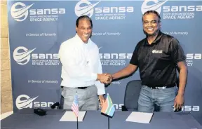  ??  ?? MARCUS Watkins, director of the Nasa management office, signs an agreement with Sansa chief executive Dr Valanathan Munsami to look at the possibilit­y of a potential ground station in South Africa. SANSA
|