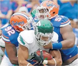  ?? AP FILE PHOTO ?? Redshirt sophomore defensive lineman Caleb Brantley, the other distractio­ns and stopped being immature.”
right,
says, “This year, I cut out all