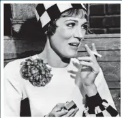  ??  ?? Not such a goody two-shoes: Julie lights up in 1967’s Thoroughly Modern Millie