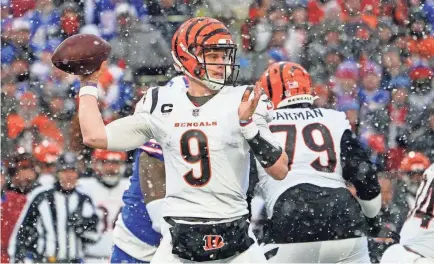  ?? GREGORY FISHER/USA TODAY SPORTS ?? Bengals quarterbac­k Joe Burrow had two touchdown passes against the Bills on Sunday at snowy Highmark Stadium.